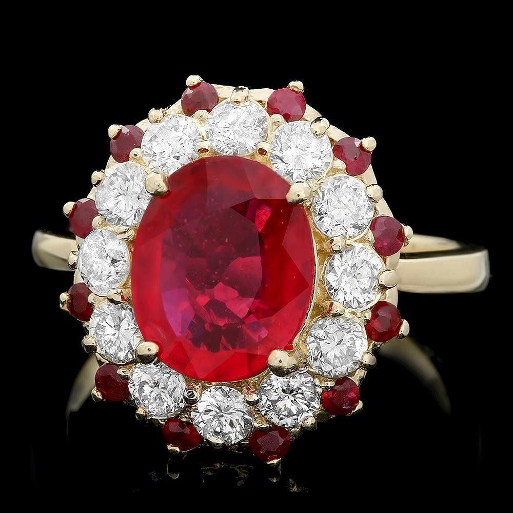 14k Yellow Gold 3.5ct Ruby 1.10ct Diamond Ring: This luxurious ladies ring is crafted in solid 14k Yellow Gold and features a 3.00 carat Natural Ruby mined from India + accented with 12 sparkling eye-clean natural diamonds, totaling 1.10 carats. Ex