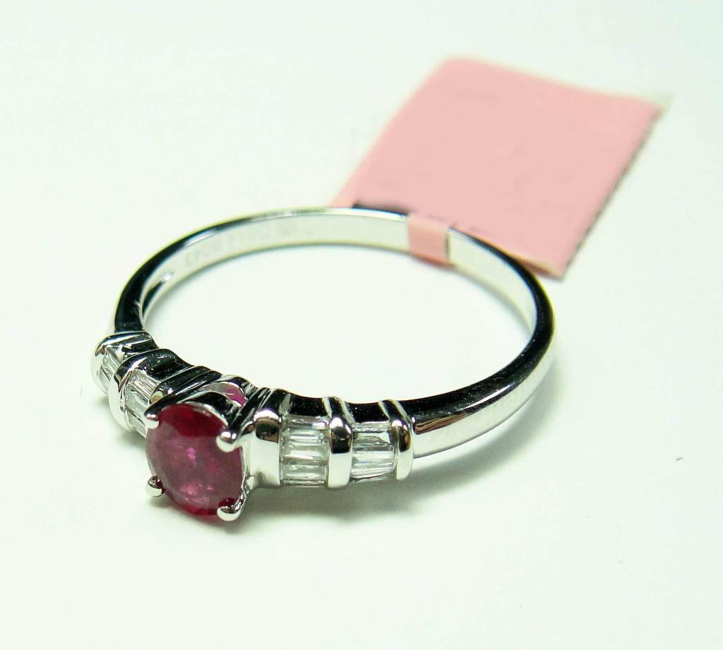 14KT Gold, 0.43ct Red Ruby & 0.14ct Diamond Ring: 14KT White Gold, NATURAL 0.43ct Oval Cut Red Ruby & 0.14ct Baugette Cut (VS1-SI2, G-I) Diamond Solitaire Style Ring. Total Weight of Ring: 2 grams.