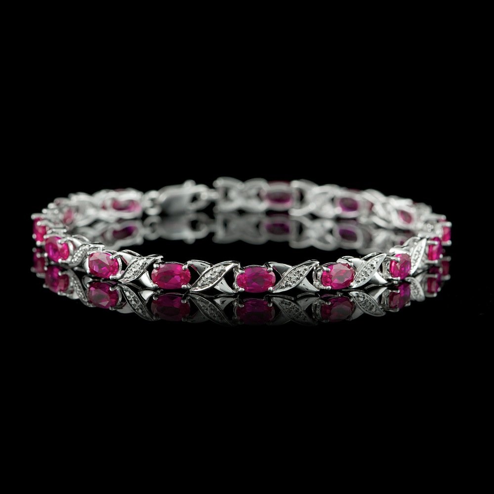Sterling Silver 5.00Ct Ruby and Diamond Bracelet: Sterling Silver 5.00Ct Ruby and Diamond Bracelet ****** Metal: .925, Sterling Silver / Total Item Weight: 7.0 grams / / Main Stone: Ruby / Color: Pink / Carat Total Weight: 5.00 / Treatment: Created /