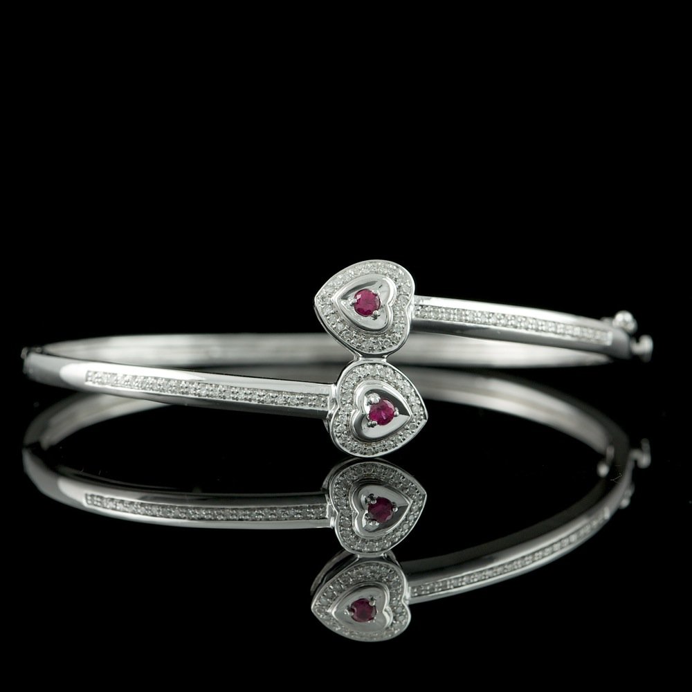 Sterling Silver 0.10Ct Ruby 0.26ct Dia Bracelet: Sterling Silver 0.10Ct Ruby 0.26ct Dia Bracelet ****** Metal: .925, Sterling Silver / Total Item Weight: 11.3 grams / / Main Stone: Ruby / Color: Red / Carat Total Weight: 0.10 / Clarity: Type 2 / Cut