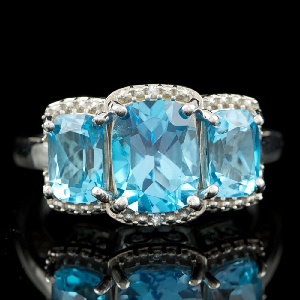 925 Sterling Silver Topaz 0.01ct Diamond Ring: 925 Sterling Silver Topaz 0.01ct Diamond Ring ****** Metal: .925, Sterling Silver / Total Item Weight: 4.8 grams / / Main Stone: Topaz / Color: Blue / Clarity: Type 2 / Cut: Very Good / / Secondary St