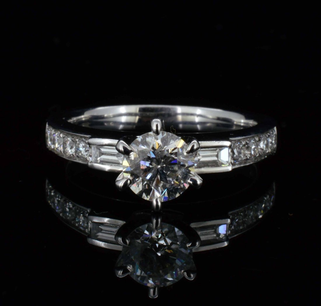 18KT Gold, 1.01ctw (0.71ct CNTR) Diamond Solitaire Styl: 18KT Gold, 1.01ctw (0.71ct CNTR) Diamond Solitaire Style Ring. Center diamond specifications: 0.71ct - Round Brilliant Cut - Clarity Grade: SI2-SI3 - Color: G-I. Certificate of Appraisal is included. 