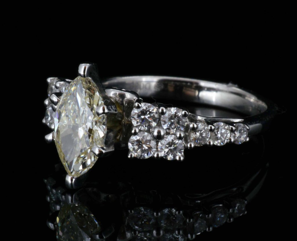 18KT Gold, 1.02ctw Marquise Fancy Yellow Diamond Ring: 18KT Gold, 1.02ct Diamond Ring. Total weight of Ring: 4 Grams. A 8000