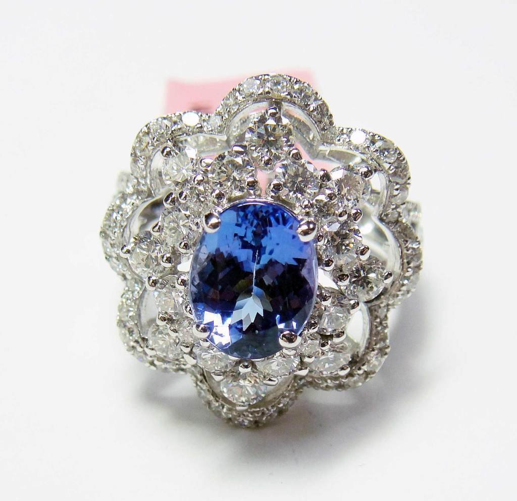 18KT Gold, 2.06ct Tanzanite & 1.91ctw Diamond Ring: 18KT White Gold, NATURAL 2.06ct Oval Cut Clean Tanzanite & 1.91ctw Round Brilliant Cut (SI3-I2, H-J)Diamond Ring. Total Weight of Ring: 4.5 grams.