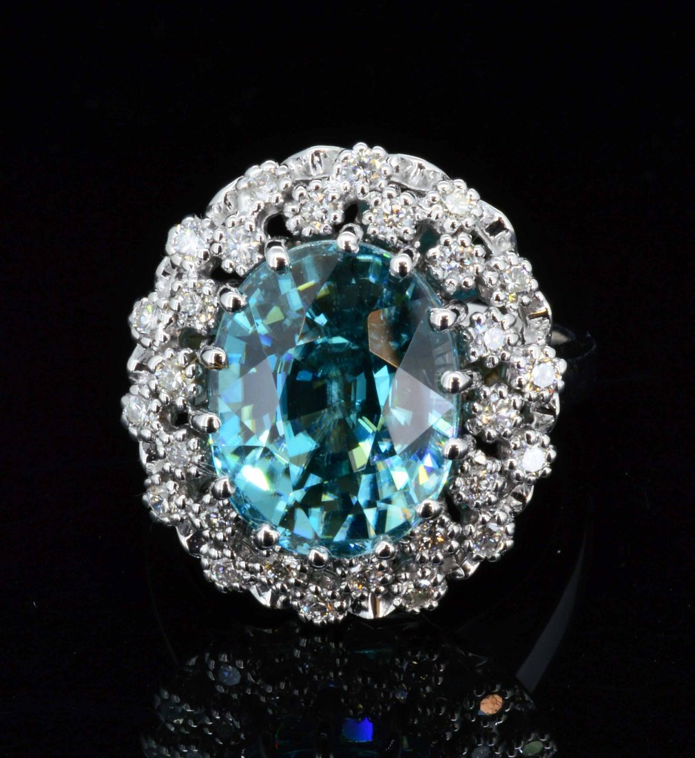 14k white gold, 9.67cts Blue Zircon & 0.48cts diamond: 14k white gold ring, 6.59gr. One center oval cut blue Zircon TW: 9.67cts. 0.448cts TW round cut diamonds. All VS-SI clarity, G-H color. A7200