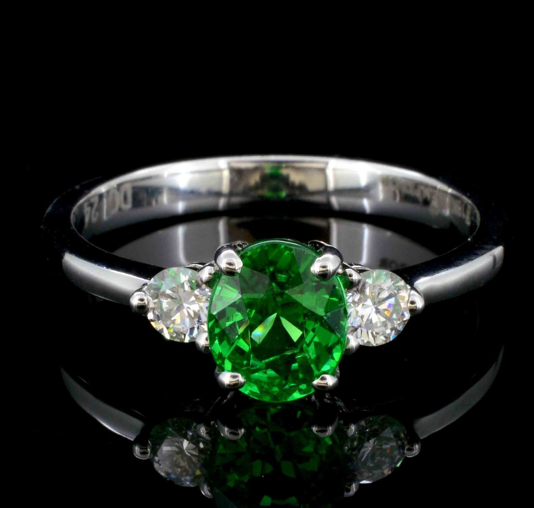 18K White Gold 0.96ct Tsavorite & 0.24ct Diamond Ring: Estimated Retail: $5,990.00Ref: WAG2240Main Gemstone: Tsavorite Garnet Shape: Oval Weight : 0.96ctColor: Green Daimaonds: Natural Diamond Shape: Round Brilliant Quantity: 2 CountsWeight : 0.24ct Cl
