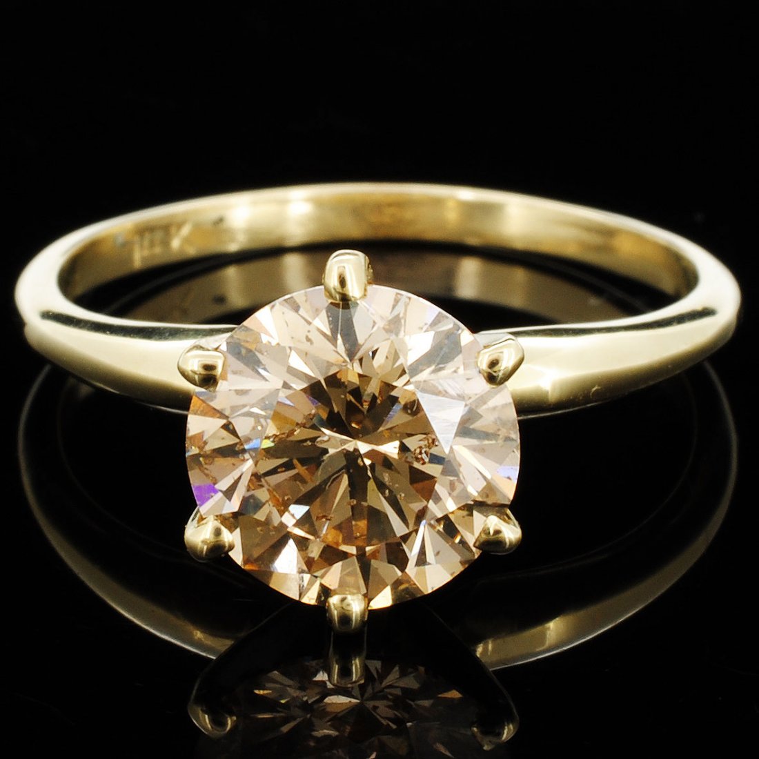 14K Gold 1.84ct Brown Fancy Diamond Solitaire Ring: Estimated Retail Replacement Value: $35,400.00 Ref: WAG14160 Gold Content: 14K Yellow Gold Weight of Item: 2.4 grams Main Gemstone: Natural Diamond Quantity: 1 counts Shape: Round Brilliant Weight: 1.