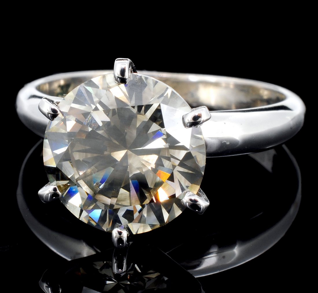 14K White Gold 3.52ct Diamond Solitaire Ring: Estimated Retail: $52,350.00 Ref: WAG20940 Gold Content: 14K White Gold Weight of Item: 3.7 grams Main Gemstone: Ruby Shape: Oval Weight: 5.65 ct Color: Red Diamonds: Natural Diamonds Quantity: 1 co
