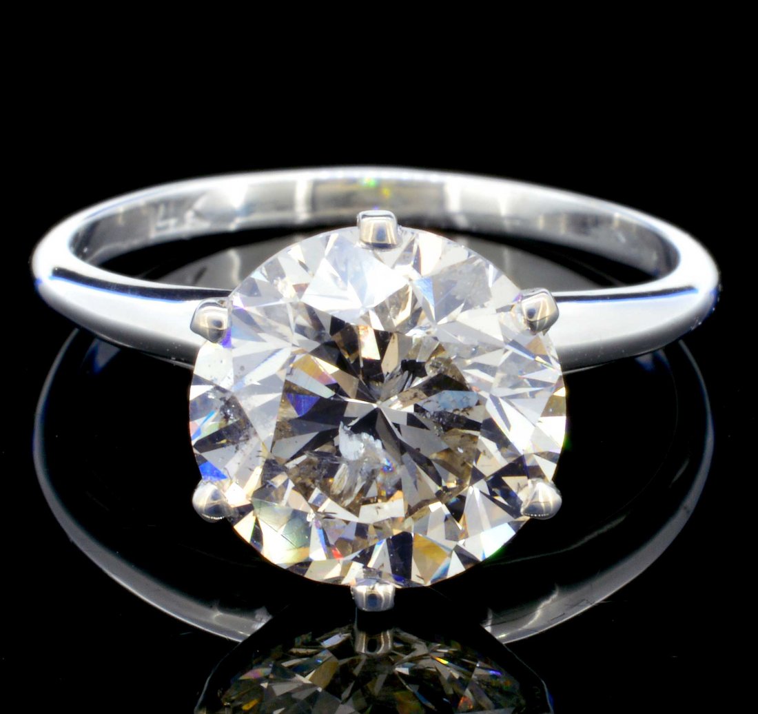 14K White Gold 3.28ct Diamond Solitaire Ring: Estimated Retail: $87,750.00 Ref: WAG35100 Diamonds: Natural Diamond Quantity: 1 counts Shape: Round Brilliant Weight: 3.28cts. Clarity Grade: SI3 Color Grade: K