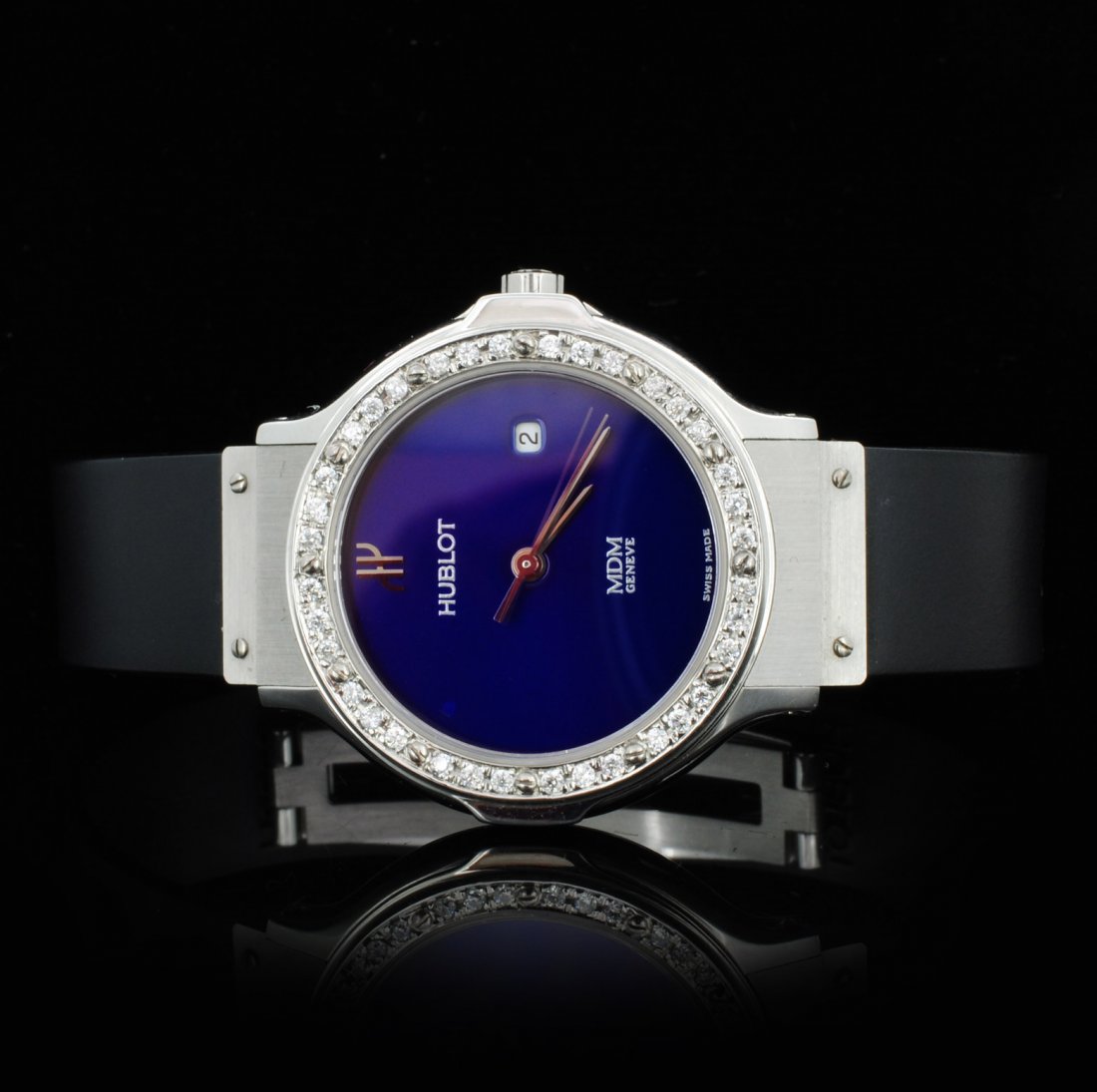 Hublot SS MDM Geneve Men's Wristwatch: Estimated Retail Replacement Value: $18,000.00 Ref: WAG14407J Item no.: CRTR0148 Specification: Documents: Gemologist Report Weight: 68.00 grams Model: Hublot MDM Geneve Watch Movement: Quartz Movemen
