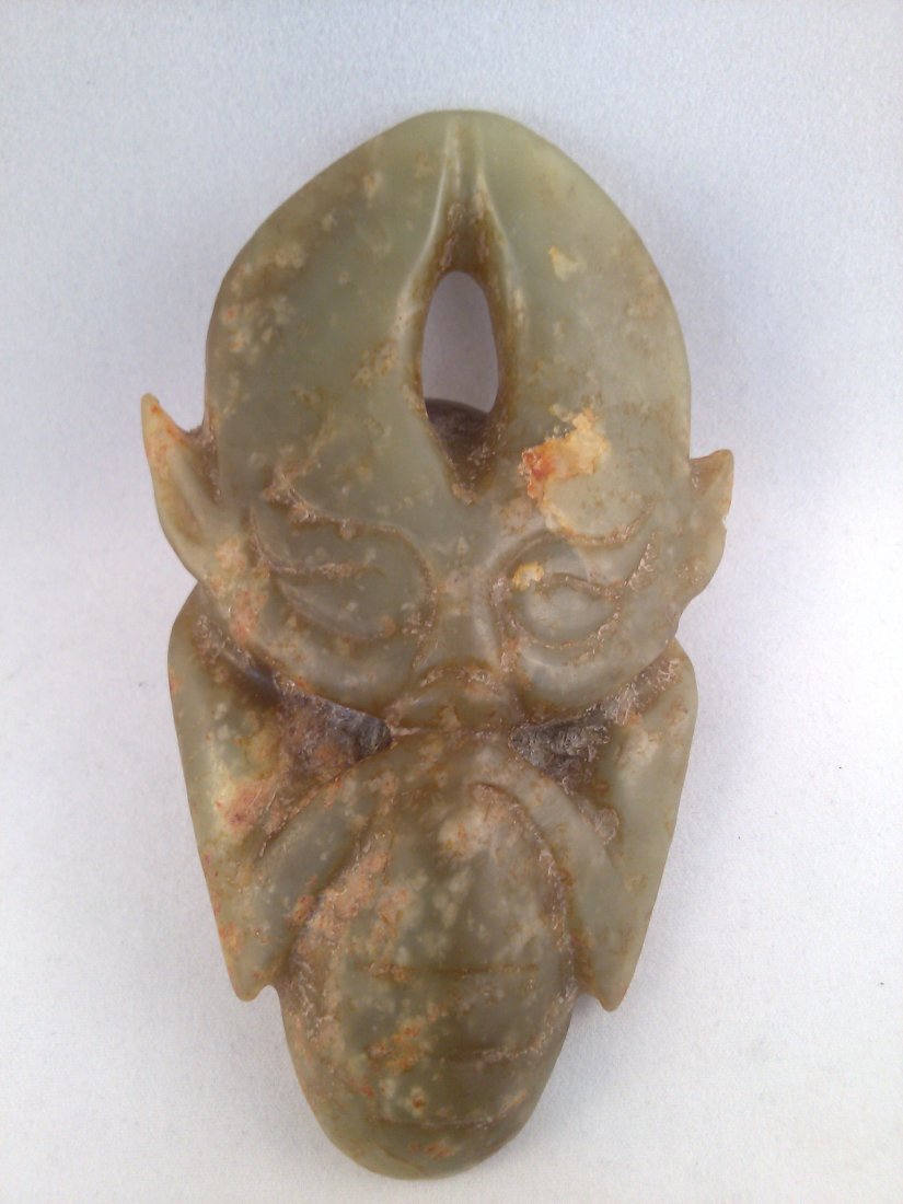 A Hongshan culture Neolithic period Jade carved: A Hongshan culture Neolithic period Jade carved humanoid alien figure pendant. 4.25"H x 2.5"W