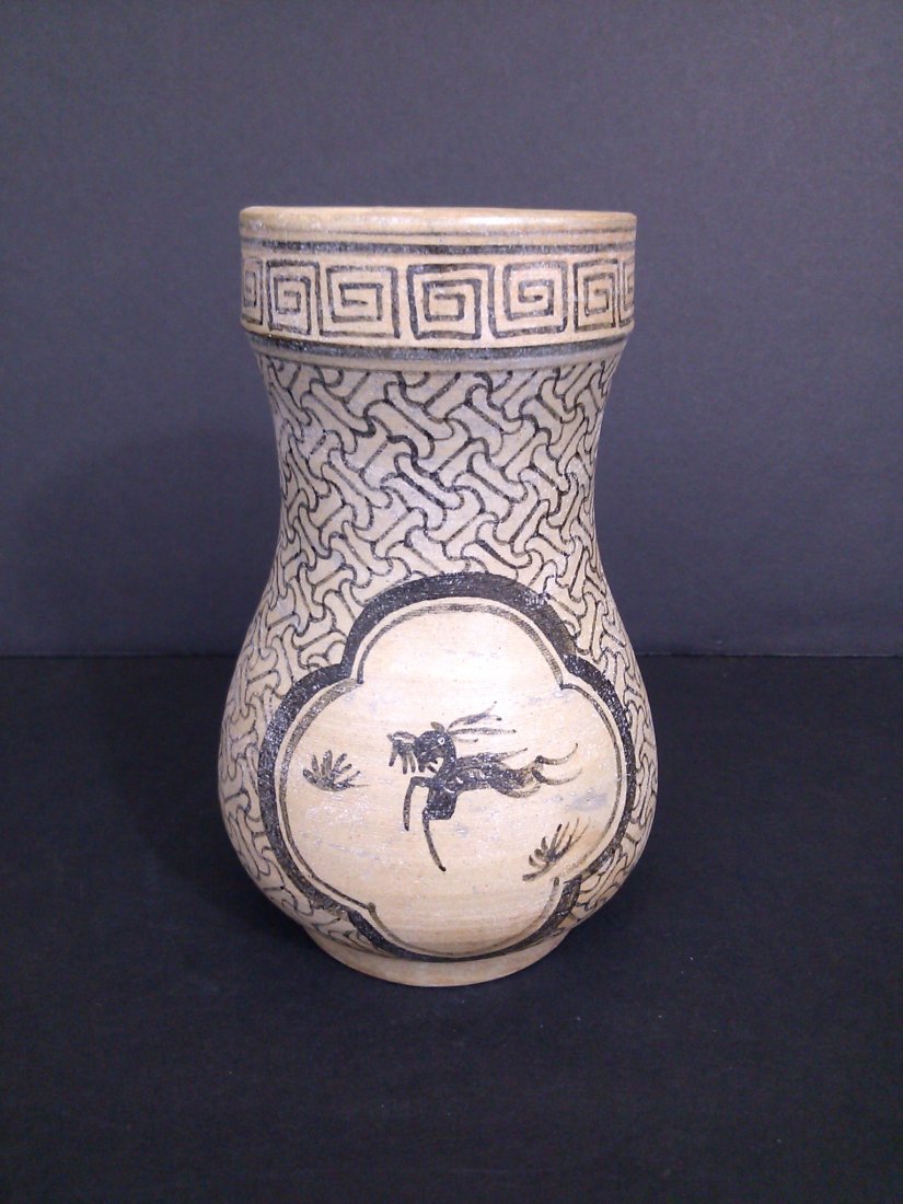 A two tone medallion pottery with ebony topical hand: A Song dynasty two tone pottery clay vase with ebony topical hand painting and intricate patterns. Four character square seal mark inscription at the base. 6"H x 3.75"D