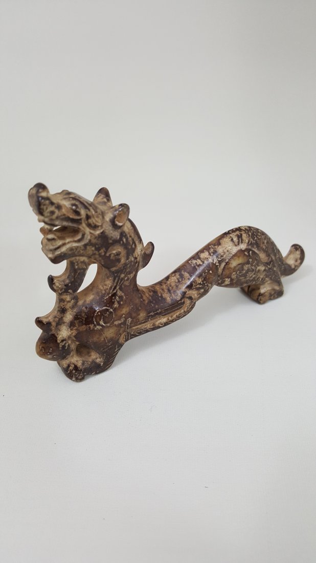 A Small Nephrite Dragon Carving Han Style: A nephrite carving of a Han dynasty style dragon figure. 5"Lx 3"Wx 0.5"D