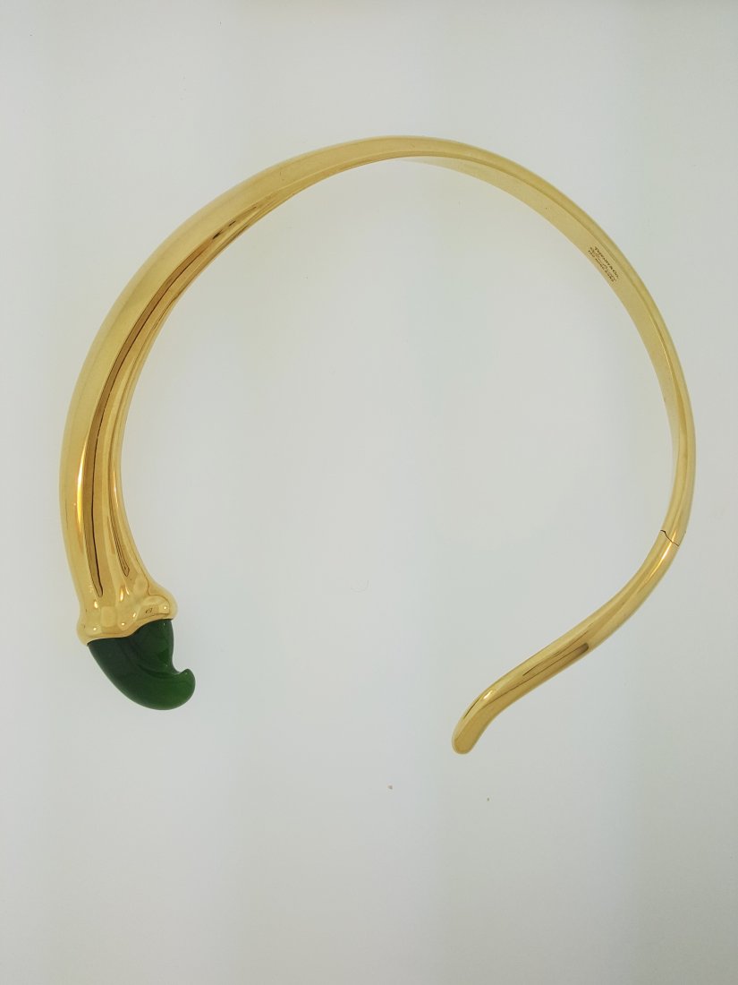 A Tiffany & Co. 18k Gold and Jade Elsa Peretti Claw: A Tiffany & Co. Gold and Jade Elsa Peretti Claw Necklace with a gleaming choker design in 18k gold with green jade claw adornment. Total weight 100 grams. Stamped 750 Hong Kong with the designer's sig