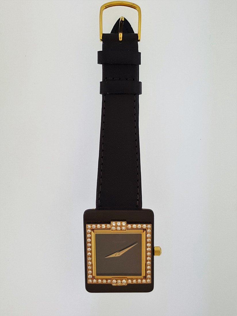 A Century Watch with Diamonds and 18k Gold, by Haimoff-: A Century Diamond Watch By Haimoff with 18k gold case, crown and hand dial, set with 0.75 carat diamonds. Strap is Hadley Roma genuine calfskin. Swiss made. Face 1.5"x1".
