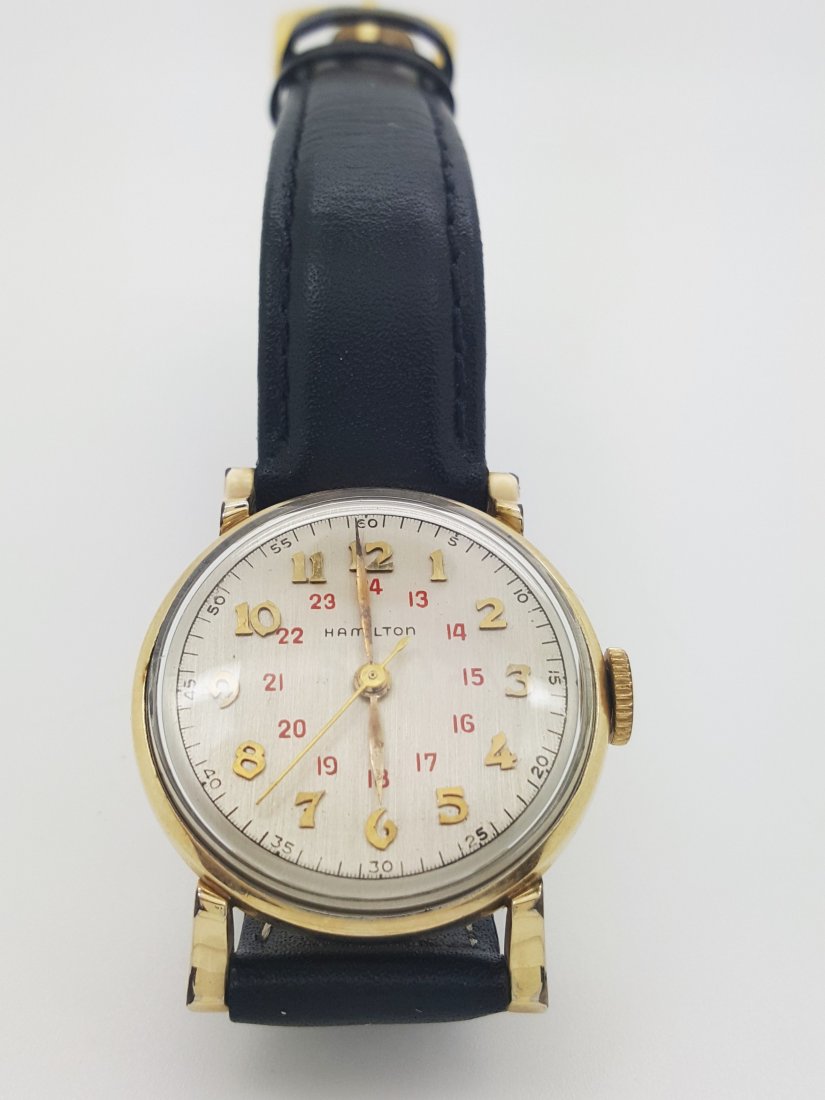 A Hamilton 14k gold filled vintage automatic men's: A Hamilton 14k gold filled vintage automatic men's wrist watch, round dial with gold Arabic numerals and red inner 24 hour-track; hour and minute and second hand. Genuine black leather strap 9" long,