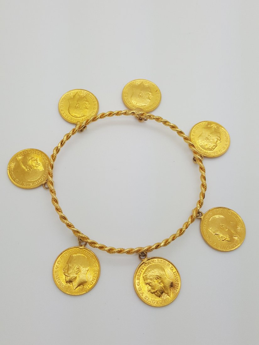 A vintage 22k yellow gold bangle bracelet with 7 coins (1 of 10)