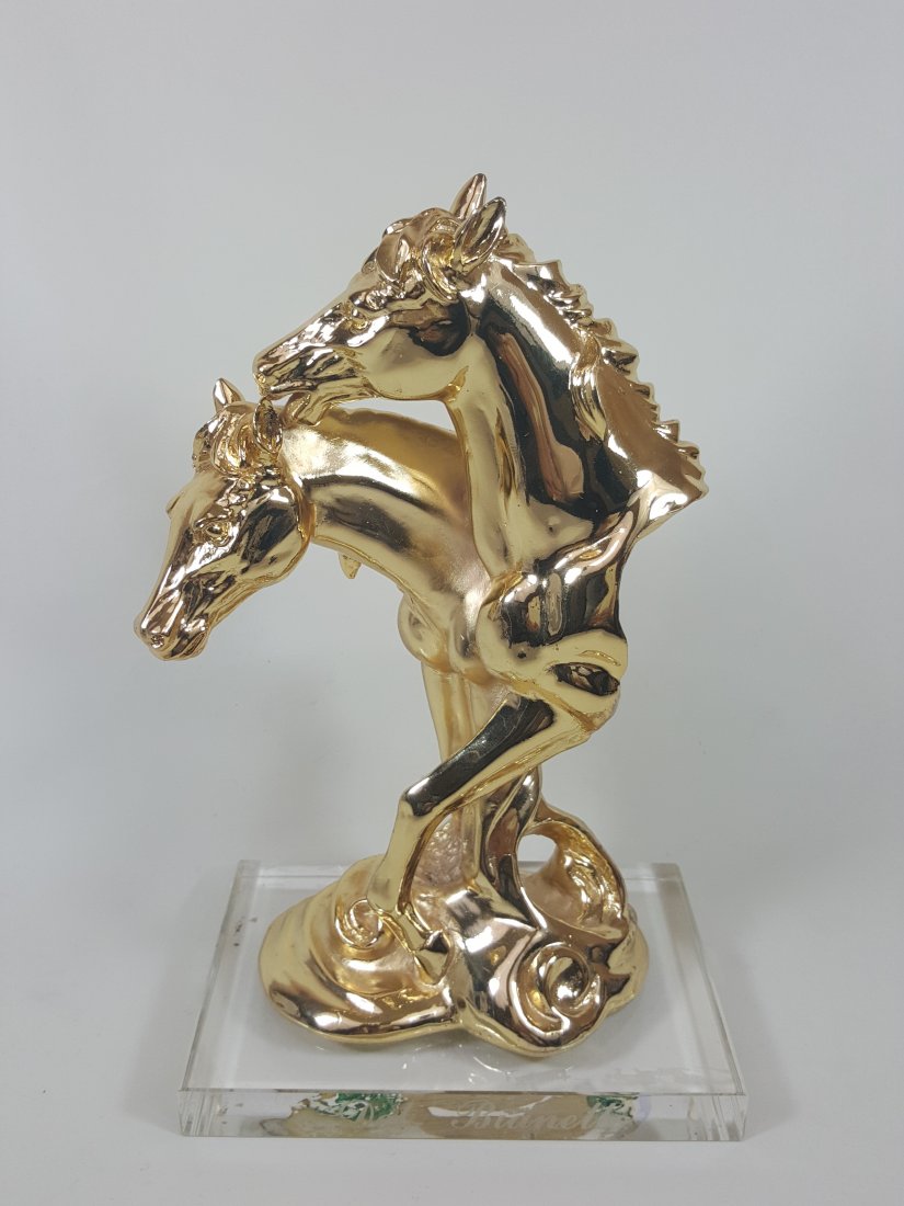 A figure of horse heads: A gilded alabaster figure of horse heads 10.1/4"x6.1/4"