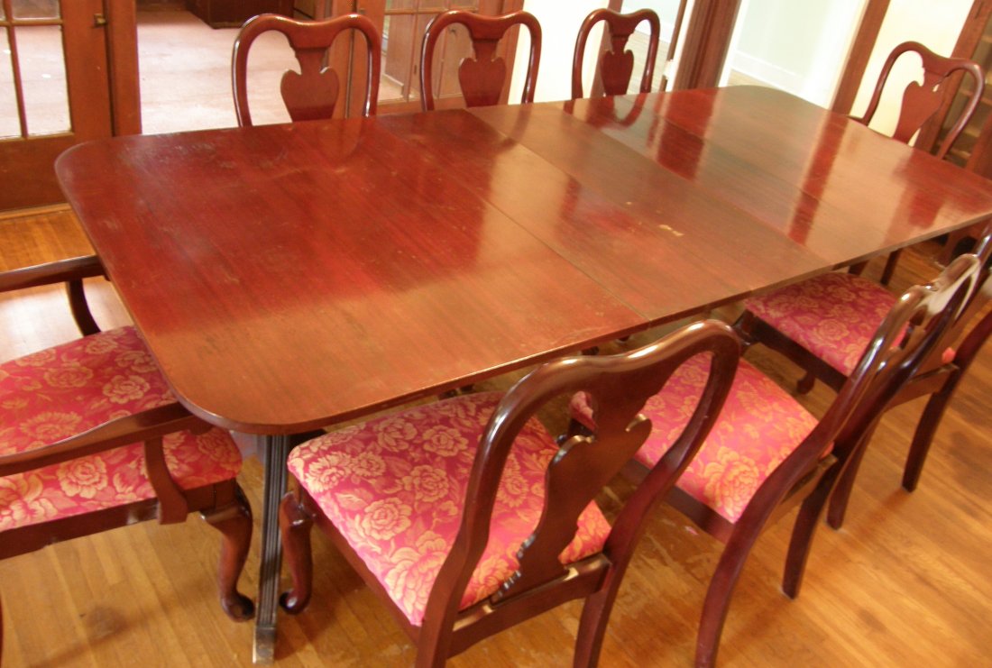 Dining table set with 10 chairs.: Dining table with 10 chairs. Donated from home of "Peacock Alley" author, Dorothy Hom