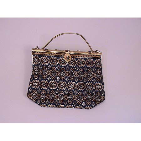 Vintage beaded bag: A vintage beaded bag Engraved gilt metal frame and clasp mounted with 8 applied flowerheads centering blue glass cabochons, with cobalt, gold, silver and copper beads in a geometric motif, cobalt silk