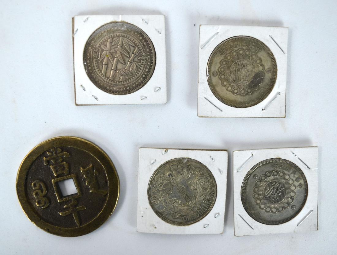 Five Chinese Coins: Include 2 from Qing dynasty, one with square hole in the middle and 3 from republic period. biggest 2 1/2" dia