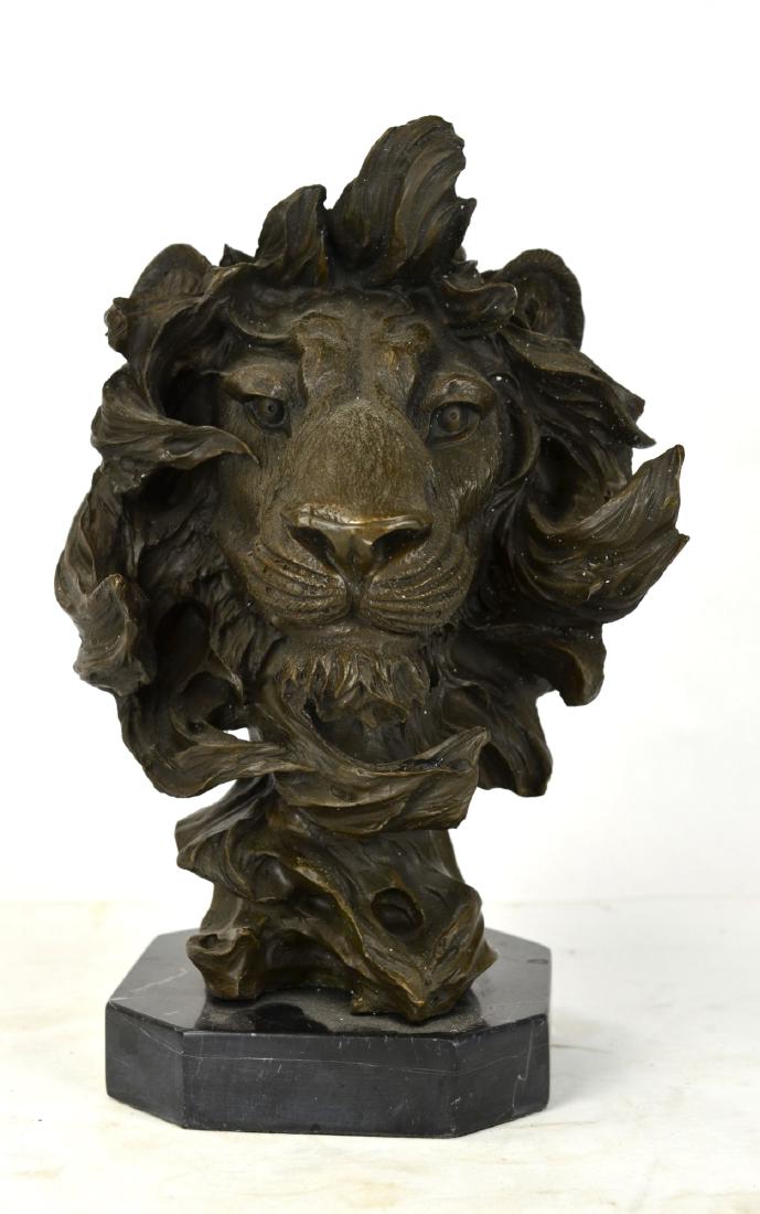 Bronze Lion Head Sculpture: Bronze sculpture of a lion head on a marble base. 13" H x 9" W