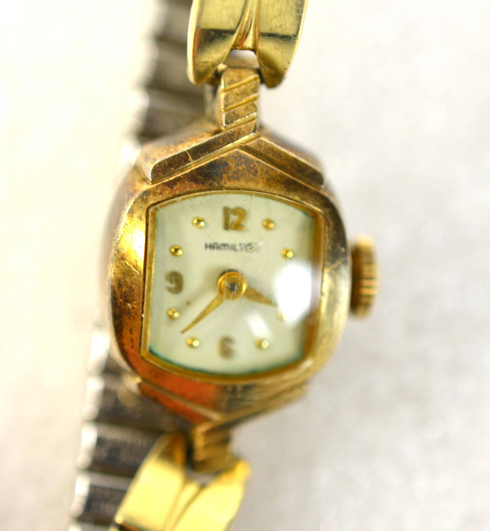 10K Gold Hamilton Lady Wrist Watch: 10K gold Hamilton lady wrist watch case with stretch spring band, case size: 17mm x25mm