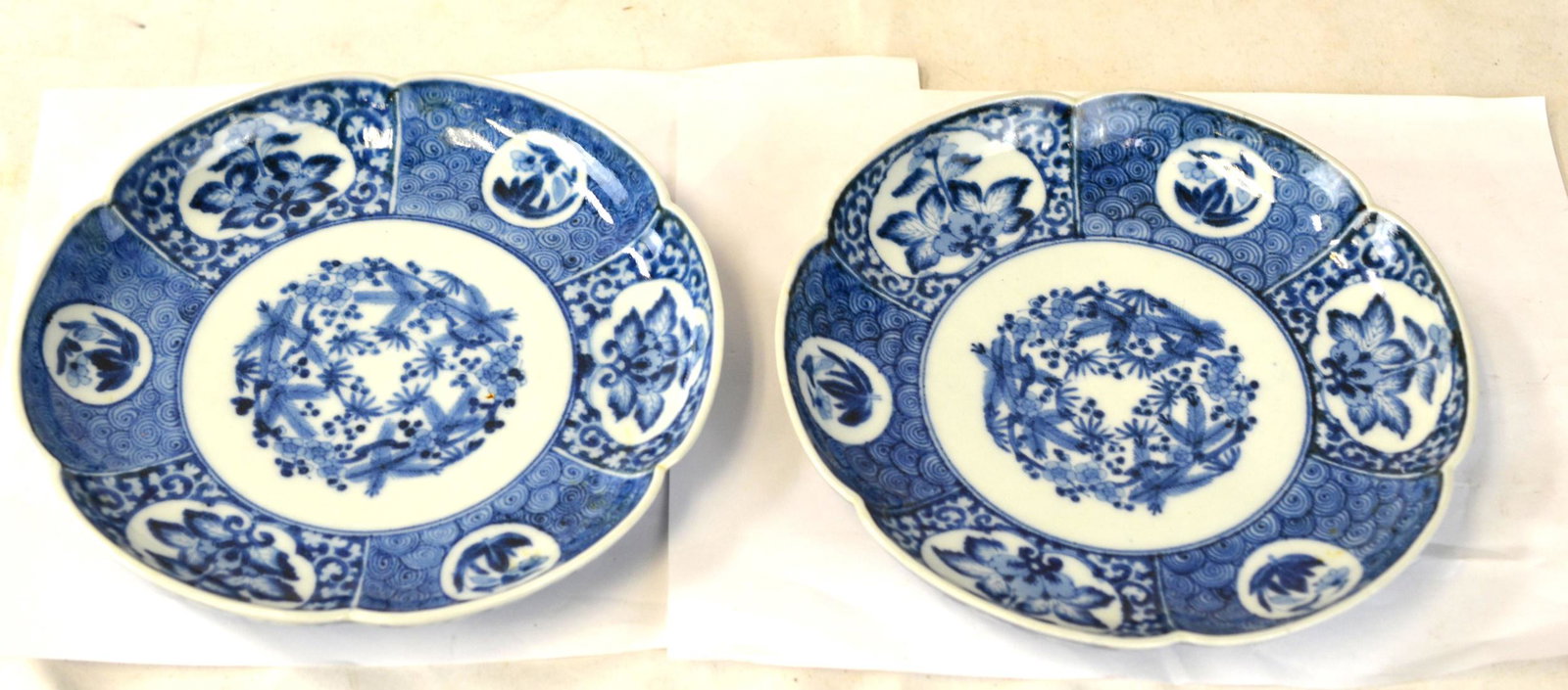 Pr Chinese Blue & White Lotus Form Plates: Qing dynasty. Pair of Chinese blue and white lotus form plates painted with flowers and mark on bottom. each size: 7 3/4"Dia x 1 1/8"H