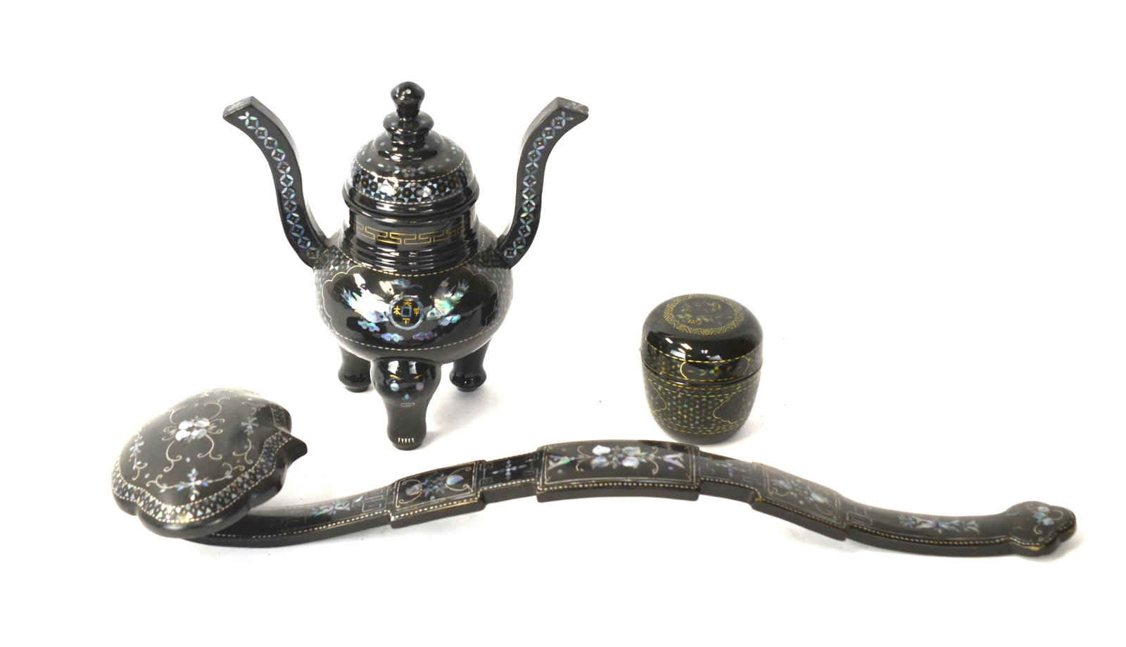 Three Chinese Mother Pearl Inlaid Black Lacquered: 20th century. Including a black lacquered mother pearl inlaind ruyi scepter is 18 1/2"L . a black lacquered mother pearl inlaid covered censer with handles. 7"H x 7 1/4"W, and a black lacquered mother
