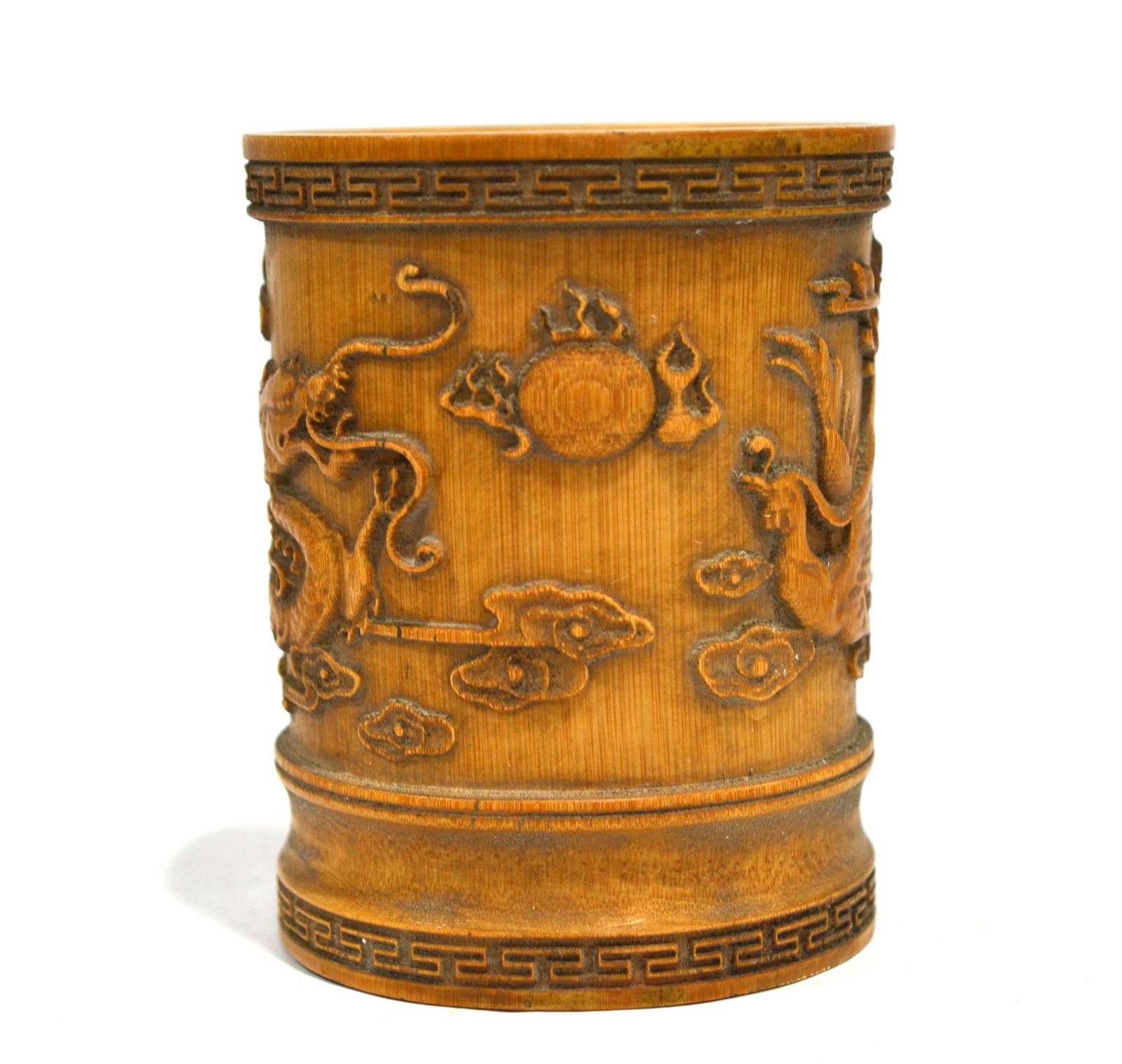 Chinese Carved Bamboo Brush Pot: Chinese bamboo brush pot carved with dragon and Chinese characters. 5 3/4"H x 4 3/8"W