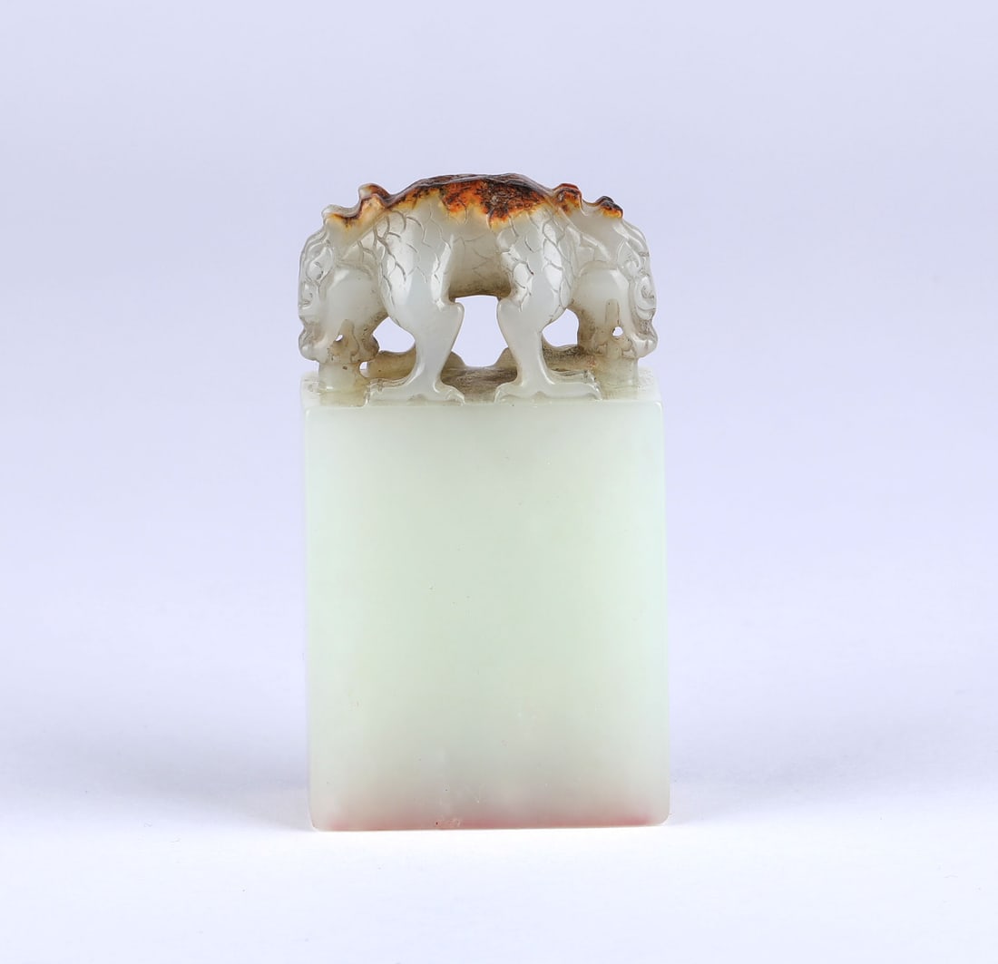A Carved White Jade Dragon Seal