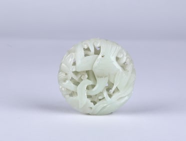 A Carved Rounded Reticulated Jade Pendant