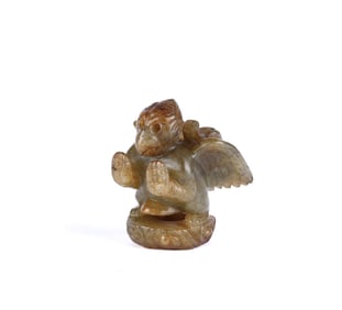 A Chinese Bird Form Russet Jade Finial