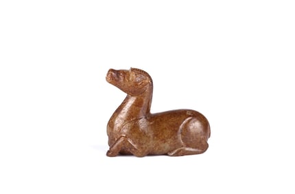 An Archaic Brown Jade Figure of Deer