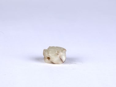 An Archaic White Jade Carving of Tiger Head