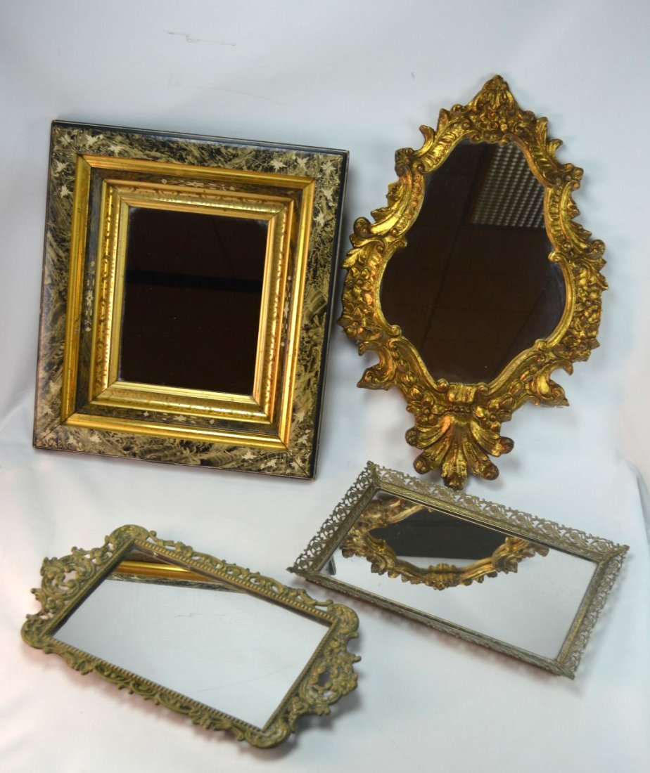Four Vintage Wall Mirrors: Four vintage wall mirrors including one carved and gilded, two metal, and one painted wood. Largest: 15" x 17"
