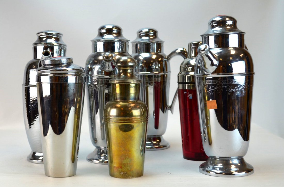 8 Barware Pieces Including Cocktail Shakers: 8 barware pieces including 4 stainless steel cocktail pitchers, 2 shakers (one without lid), 1 silverplated shaker, and one red shaker.