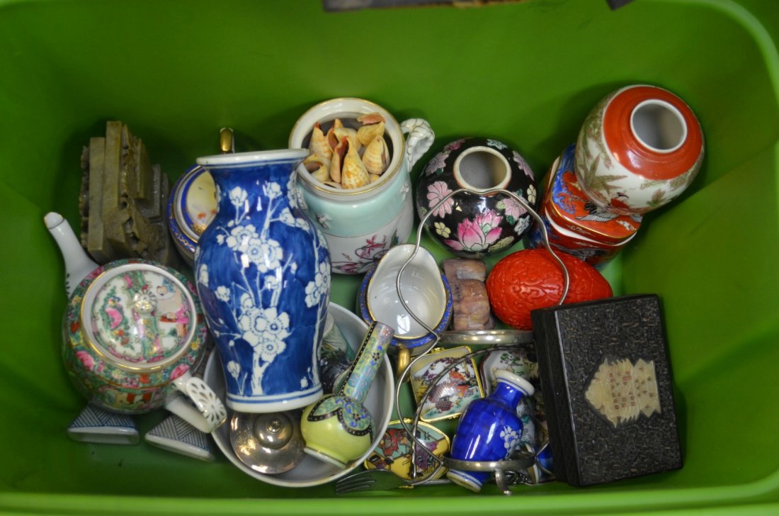 Chinese Porcelain Box Lot: Box lot of assorted Chinese porcelain including an 8" and 3" vase boldly painted in blue and white with cherry blossoms, a pair of soapstone bookends, and more.