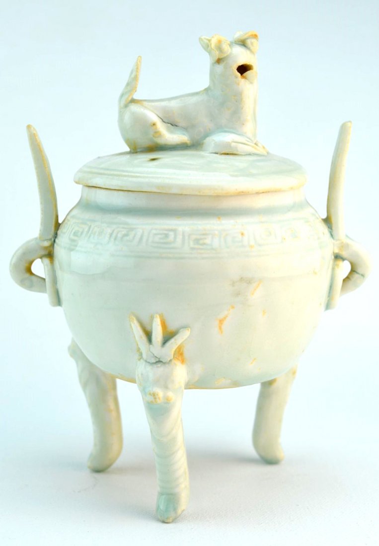 Chinese Porcelain Qingbai-Glazed Three-Legged Censer: Chinese porcelain Qingbai-glazed censer with foo dog lid, the body with incised Greek key design, on three figural legs, 13th century. 6" x 4 3/4"