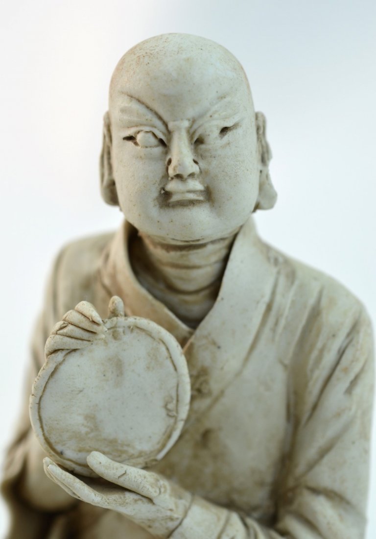 Chinese Ming-Dynasty Luohan Ceramic Figure: Chinese Ming-Dynasty Luohan ceramic figure holding a weapon or mirror. 6" x 3 1/2"