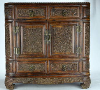 18/19th C Finely Carved Chinese Huanghuali Chest: CHINESE WOOD CHEST Finely carved huanghuali with scrolled foliate and floral design, with four drawers, and two doors, all with metal pulls. Extremely rare. 19'' x 10'' x 19''