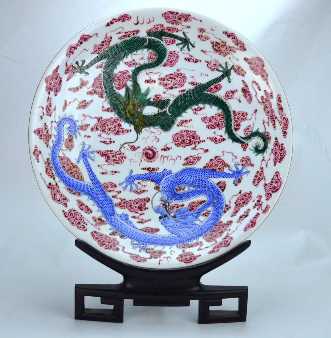 18th C Large Chinese Decorated with Muti-Dragons Plate: CHINESE PORCELAIN Charger painted with finely detailed blue and green dragon amongst swirling pink clouds, the bottom with yellow and green dragons, 18th century. Underglaze blue seal mark and paper l