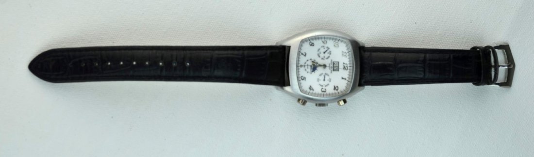 PATEK PHILIPPE Reproduction Mens Watch w/ Leather Band: PATEK PHILIPPE Reproduction mens watch with black leather band and moon-dial face. Back of band impressed with PATEK PHILIPPE. This watch is stainless steel therefore we believe it to be a reproductio