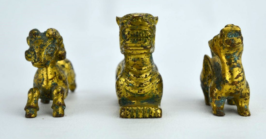 Han Dynasty Three Chinese Bronze Animal figures: CHINESE BRONZE Three figures including ram, foo dog, and pegasus or dragon, Han Dynasty. Tallest: 2''
