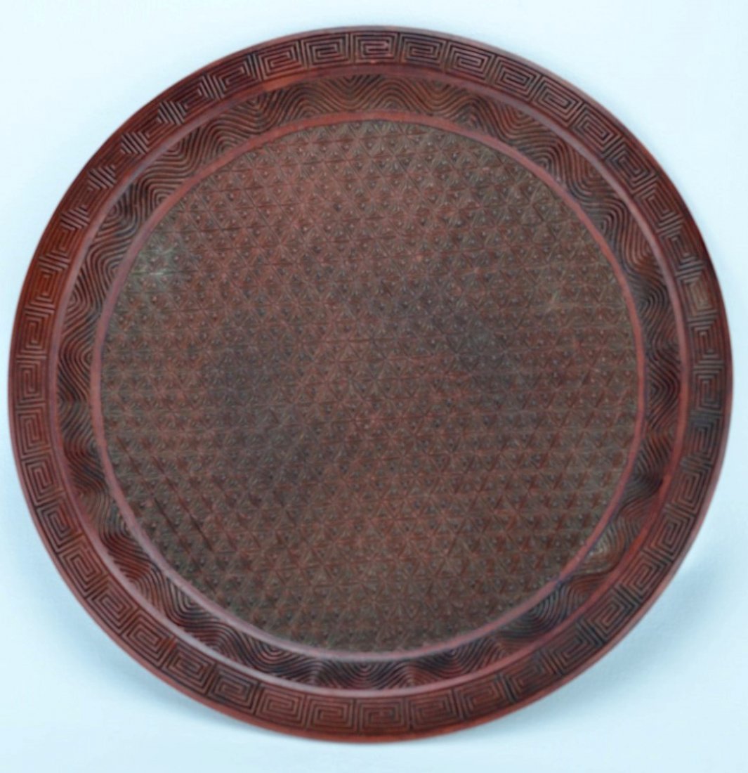 18th C Chinese Carved Cinnabar Plate with Mark: CHINESE RED LACQUER CINNABAR Plate carved with Greek Key and wave design around rim, the front in red and back in black, 18th century. Incised six character mark. 11 1/2'' dia.