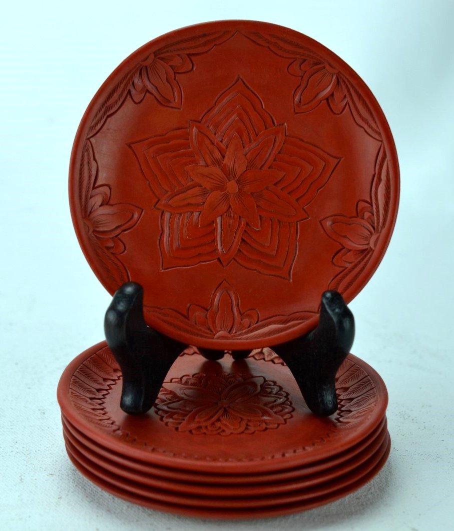 19/20th C Six Chinese Cinnabar Dish: CHINESE RED LACQUER CINNABAR Six coasters carved with varied floral designs, Republic to 19th century. 4'' dia.
