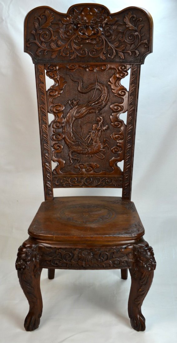 20th C Chinese Wood chair finely carved with dragon: CHINESE Wood chair finely carved with dragon and face of foo dog, the seat with large flower, atop four legs with carved masks, 20th century. 50'' x 21'' x 19''