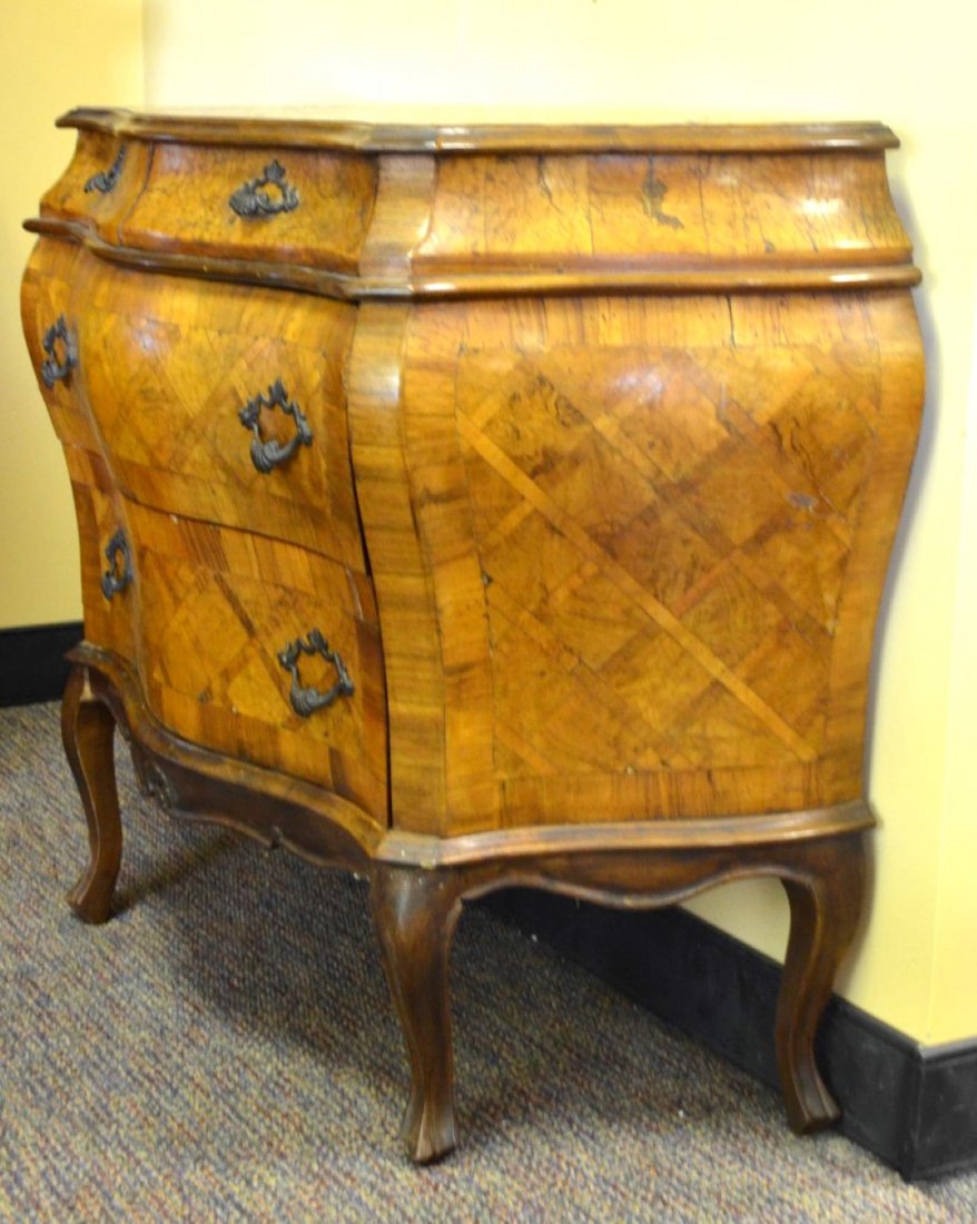 WALNUT FURNITURE Pair of Italian marquetry chests: WALNUT FURNITURE Pair of Italian marquetry walnut three-drawer chests. Broken foot and panel to one. 32 1/2'' x 41''