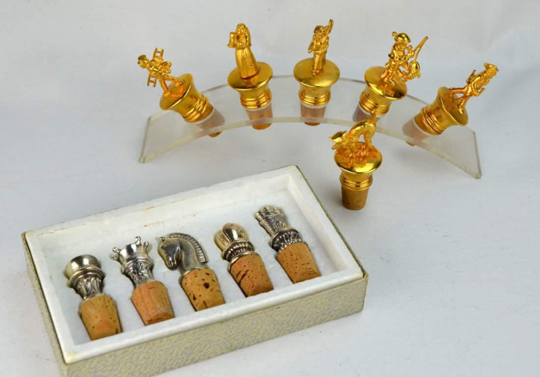 BARWARE Eleven metal-topped wine corks: BARWARE Eleven metal-topped wine corks; set of five with chess-piece theme, set of five with varied male figures including a fisherman and chimneysweep, and one Halloween cat. Unmarked. 3'' each