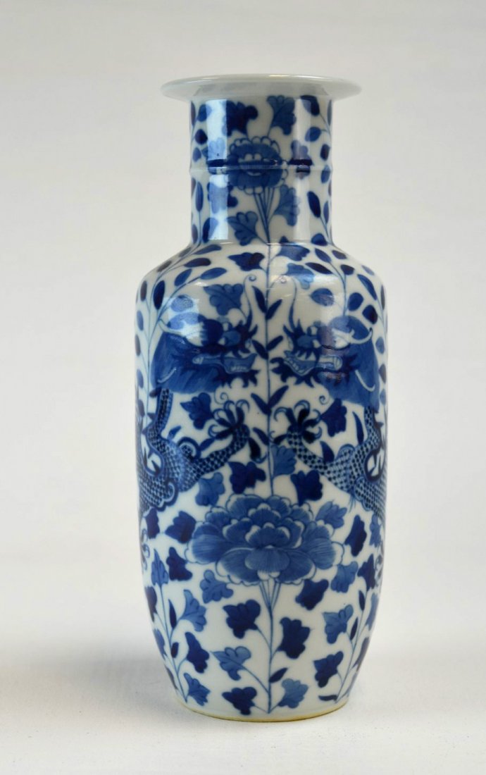 Chinese Blue & White Porcelain Rouleau Vase: 19th century Chinese blue and white porcelain Rouleau vase painted with dragons amongst chrysanthemums and leafy branches, 19th century. Underglaze blue four character mark. 9 3/4'' x 4''